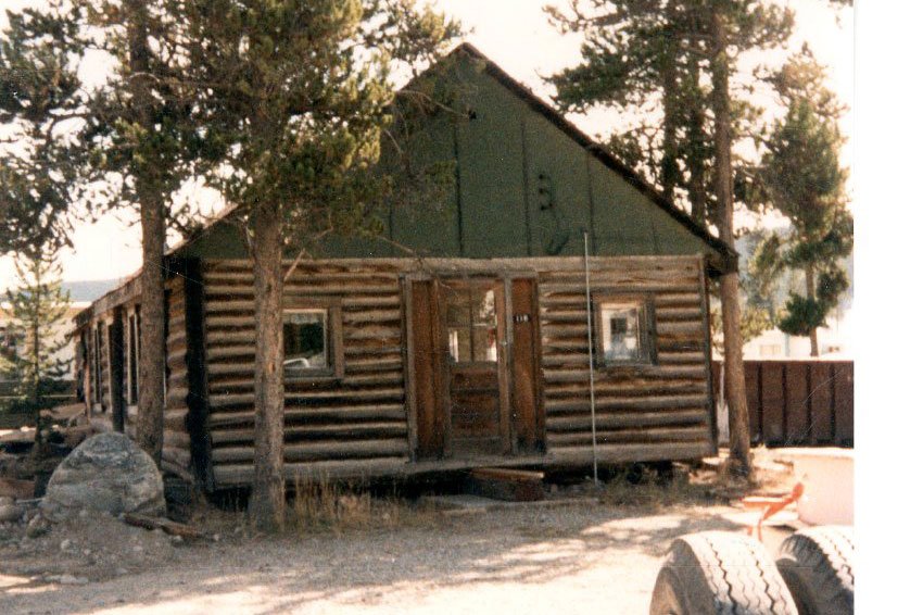 Old grainy photo of log chapel
