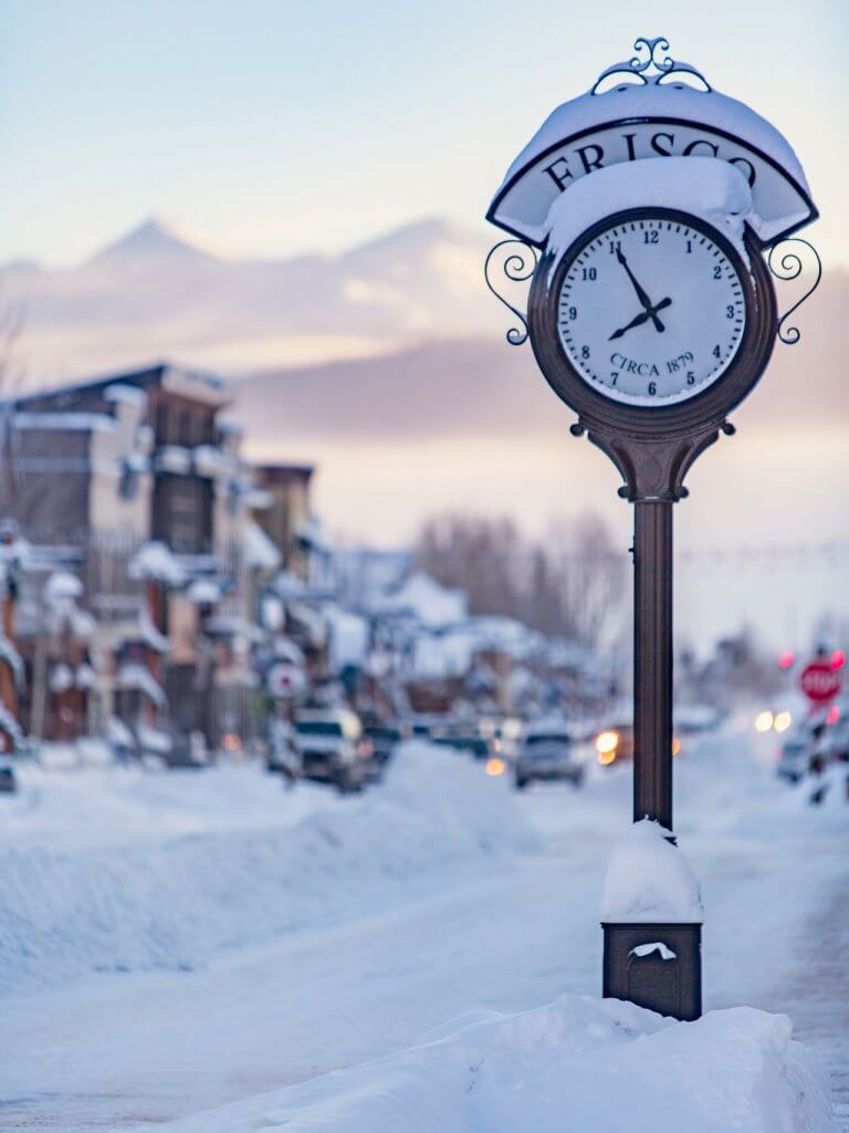 Snow covered Frisco clock, Main Street in background.