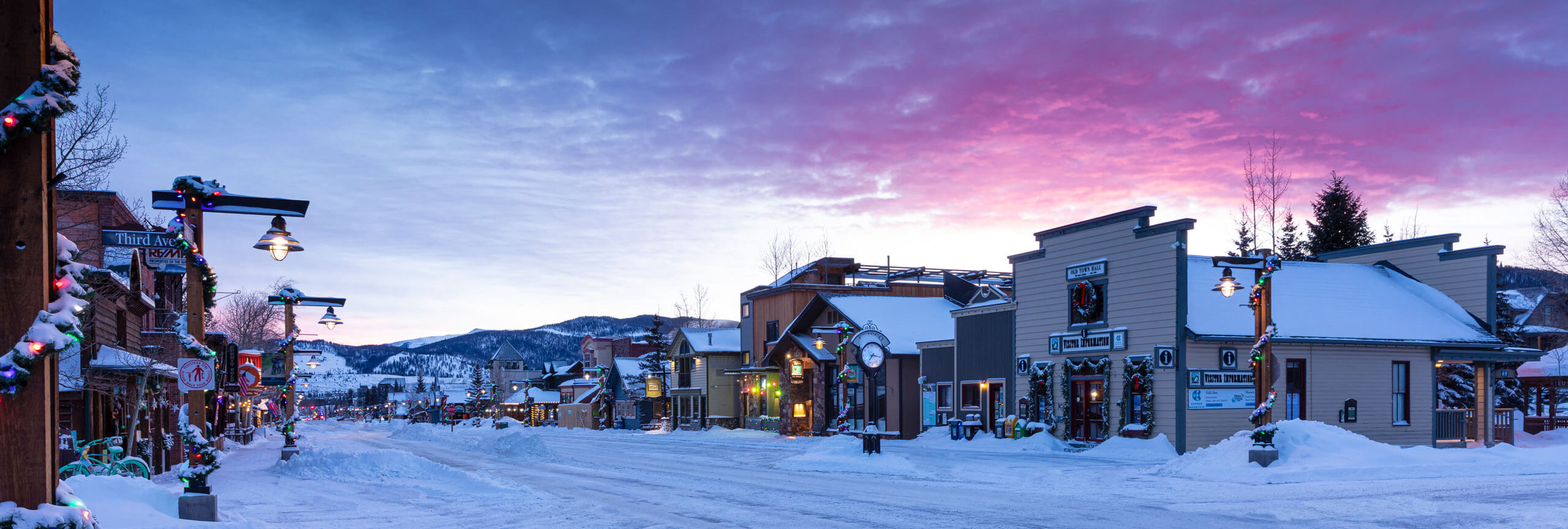 Dawn over a snowy Main Street and Visitor Information Center.