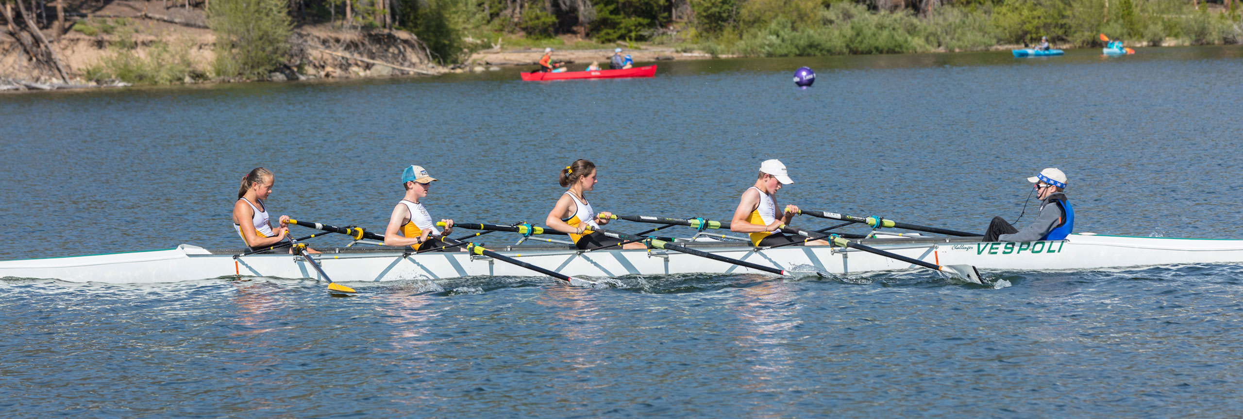 Five rowers in a rowboat on Lake Dillon.