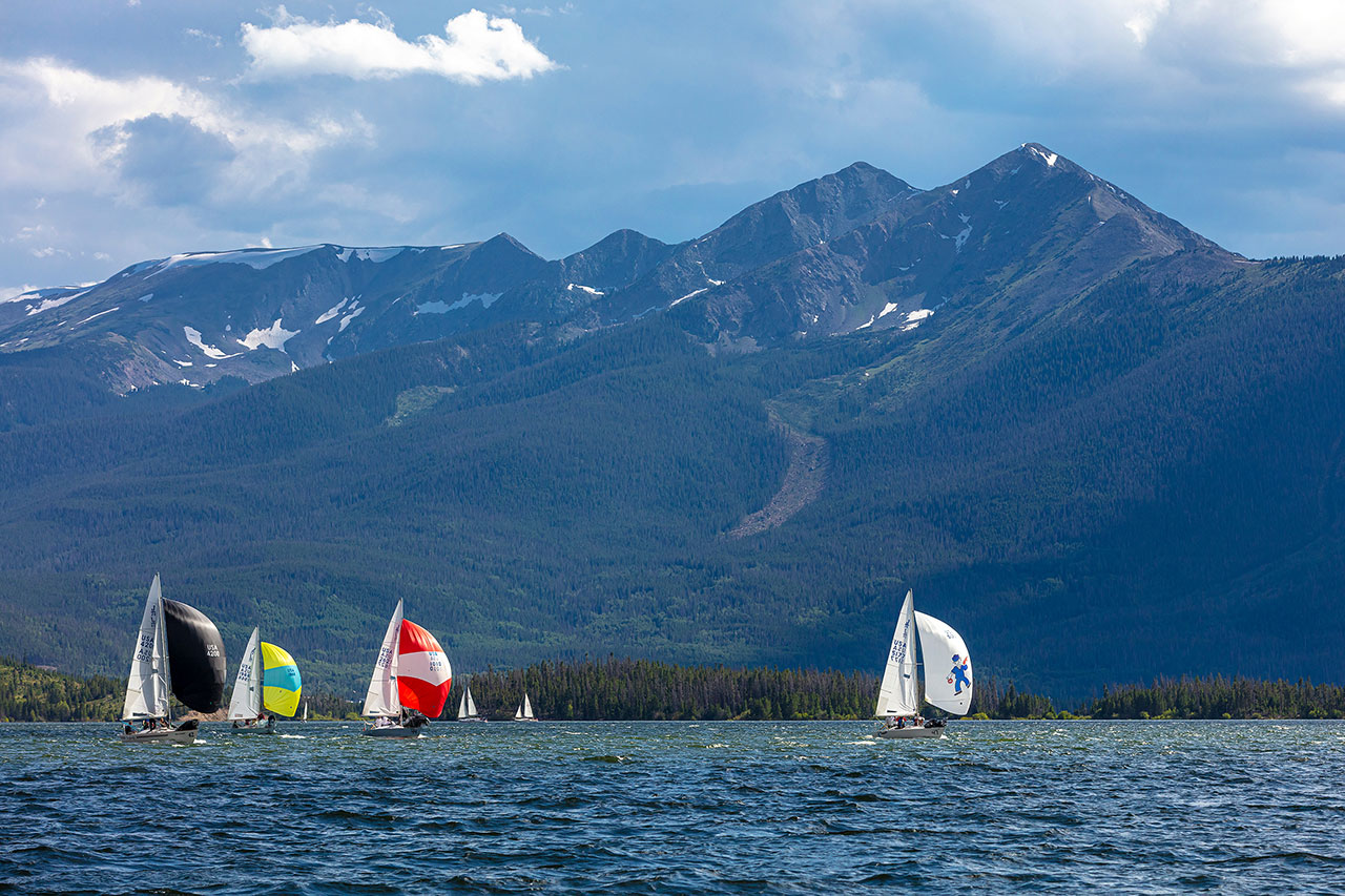 Sail boats out on a choppy Lake Dillon, Peak One in the background.