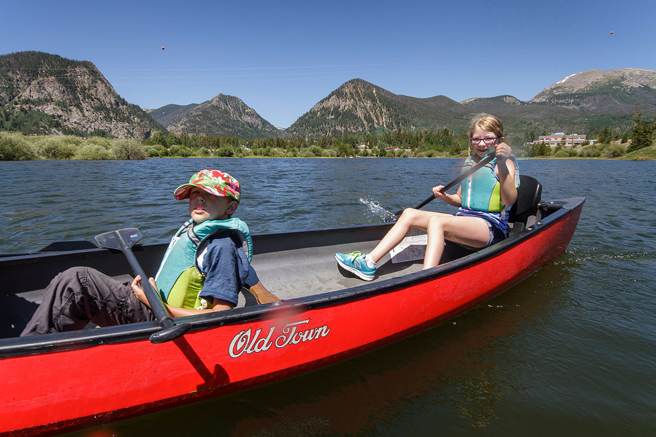 Two kids in a canoe on Lake Dillon.