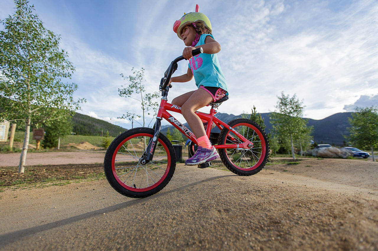Young girl riding bicycle.