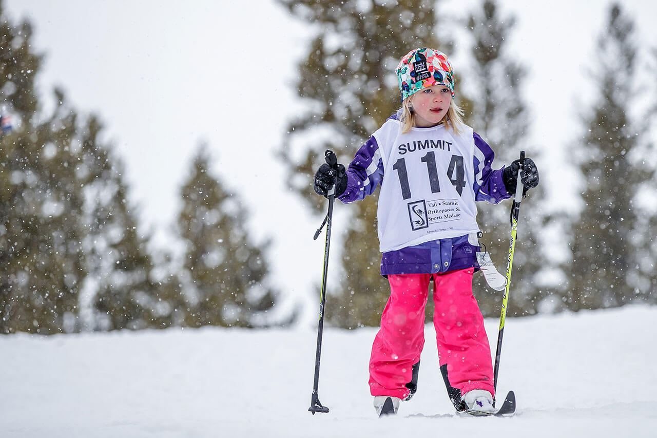 Young girl Nordic skiing.