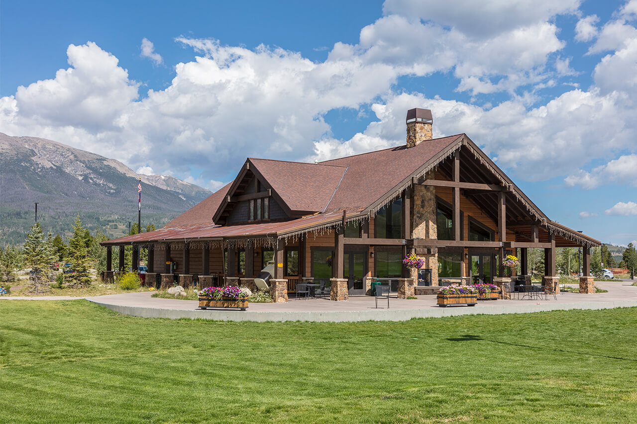 Frisco Adventure Park Day Lodge in summer with grassy lawn