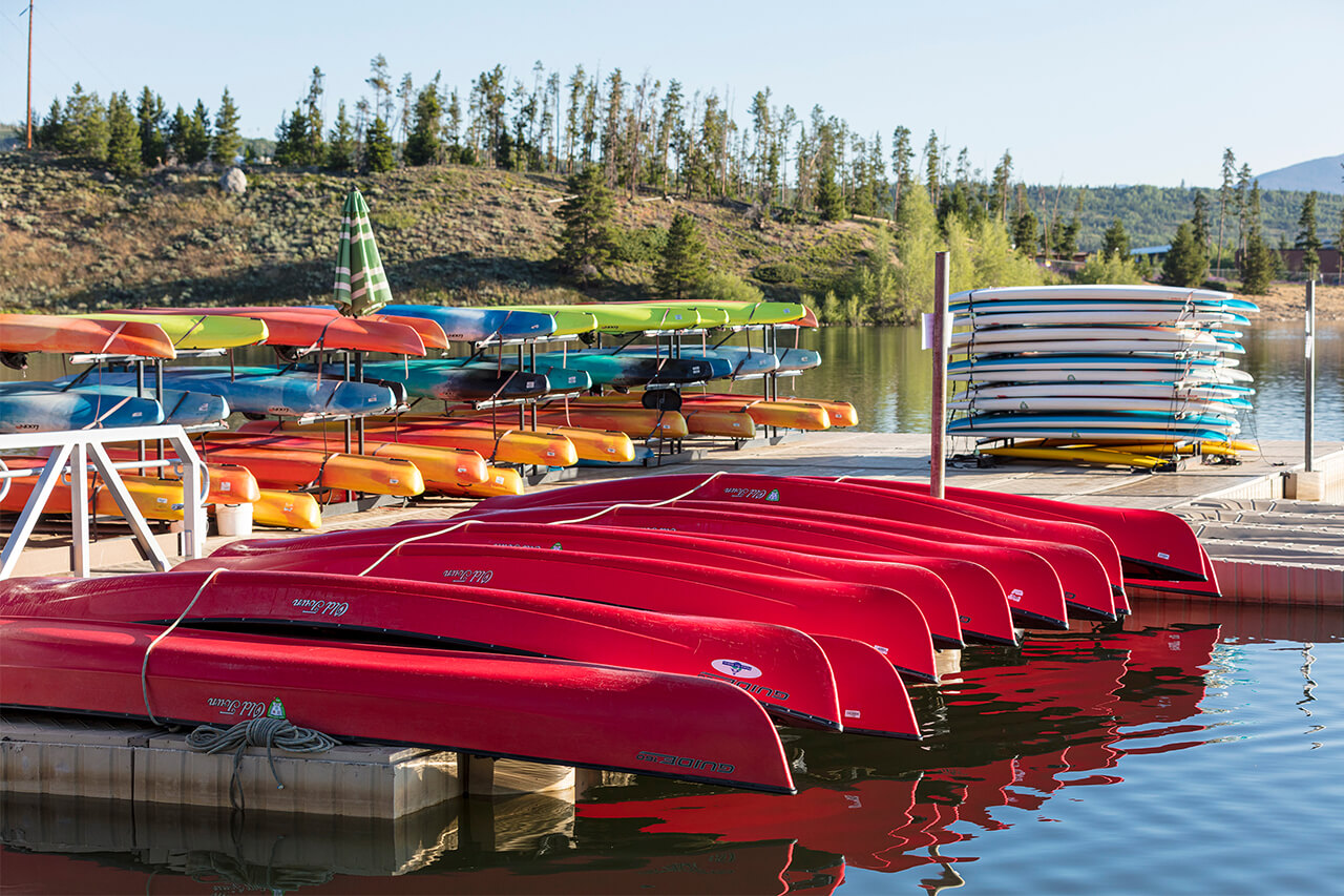 Rows of kayaks and paddleboards in their storage racks at the Frisco Bay Marina.