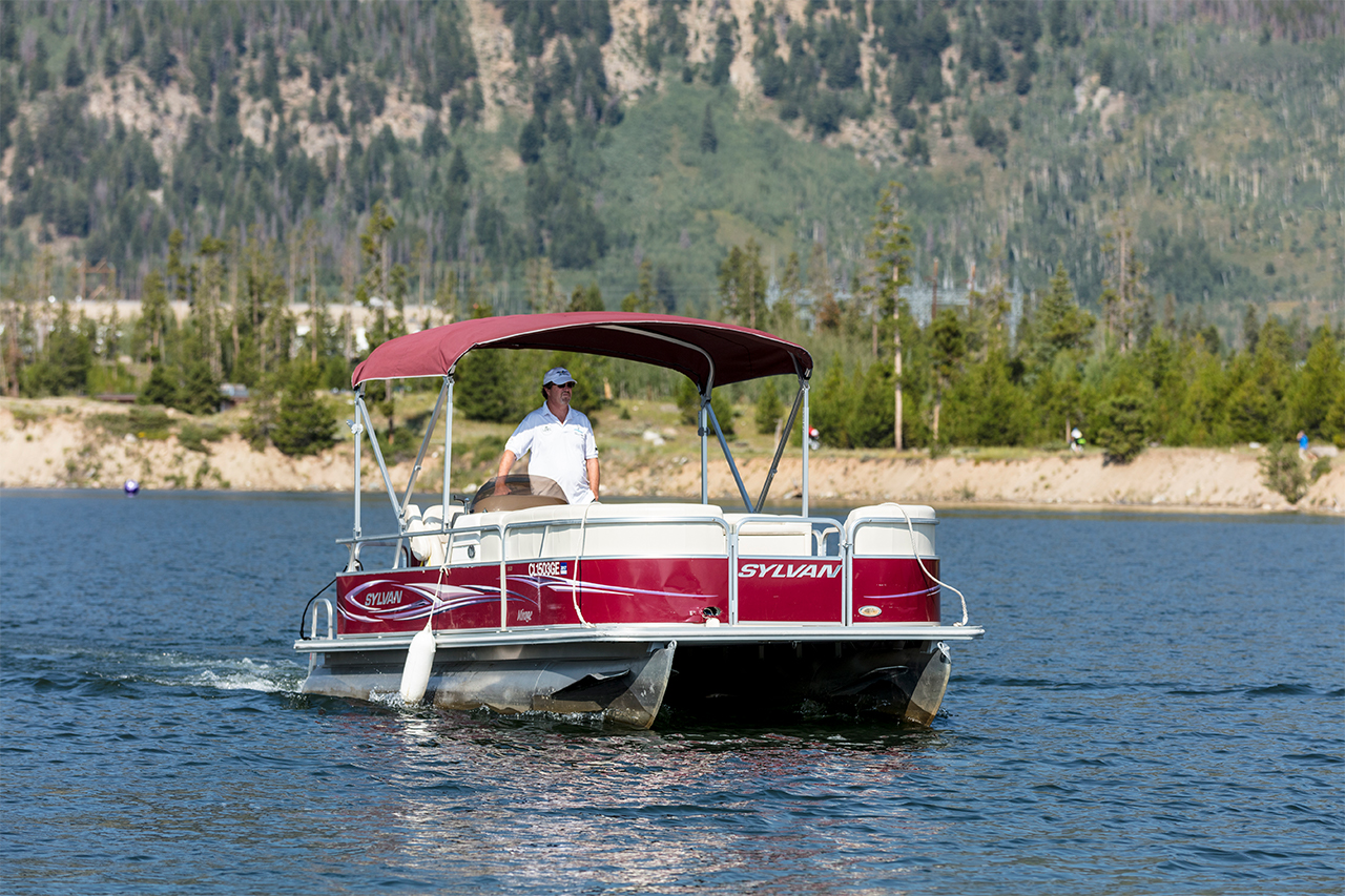 Man on pontoon boat on Lake Dillon