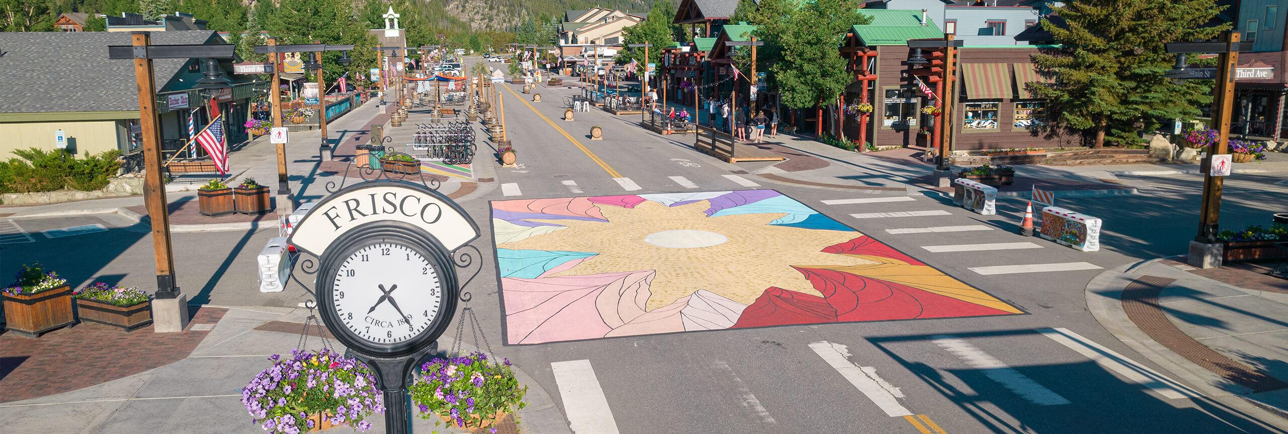 View of Frisco clock and mural at Third Avenue and Main Street