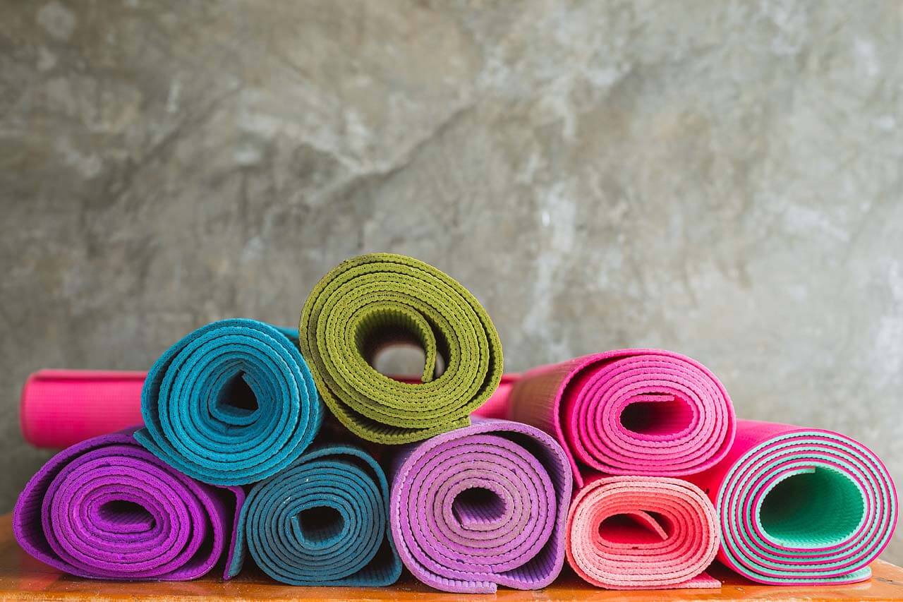 Stack of colorful yoga mats