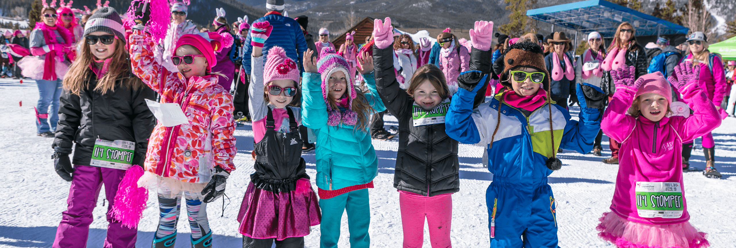 Group of kids dressed in pink at Snowshoe for the Cure