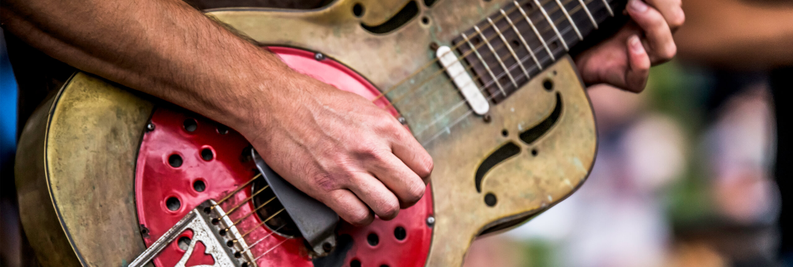Close up of man playing guitar