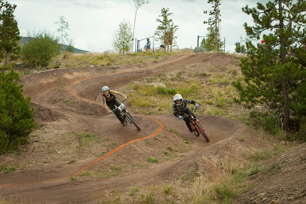 Two mountain bikers on the dual slalom course at the Frisco Bike Park
