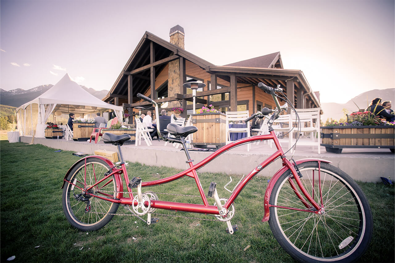 Red tandem bike at wedding in front of Day Lodge