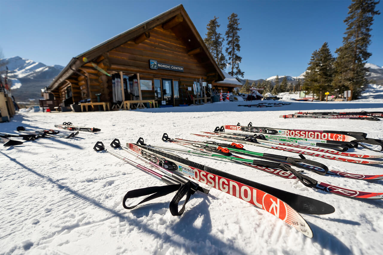 Frisco Nordic Center Lodge with Nordic skis in snow