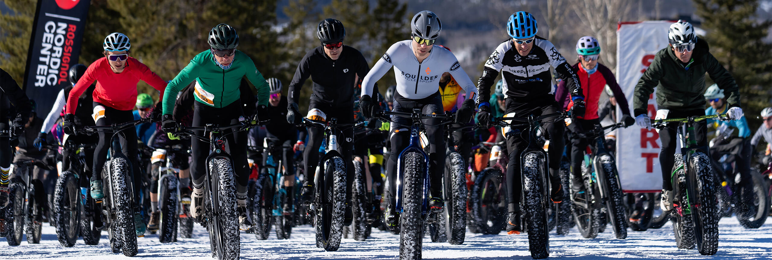 Racers on fat-tire bikes at start line of Frisco Freeeze Fatbike Race