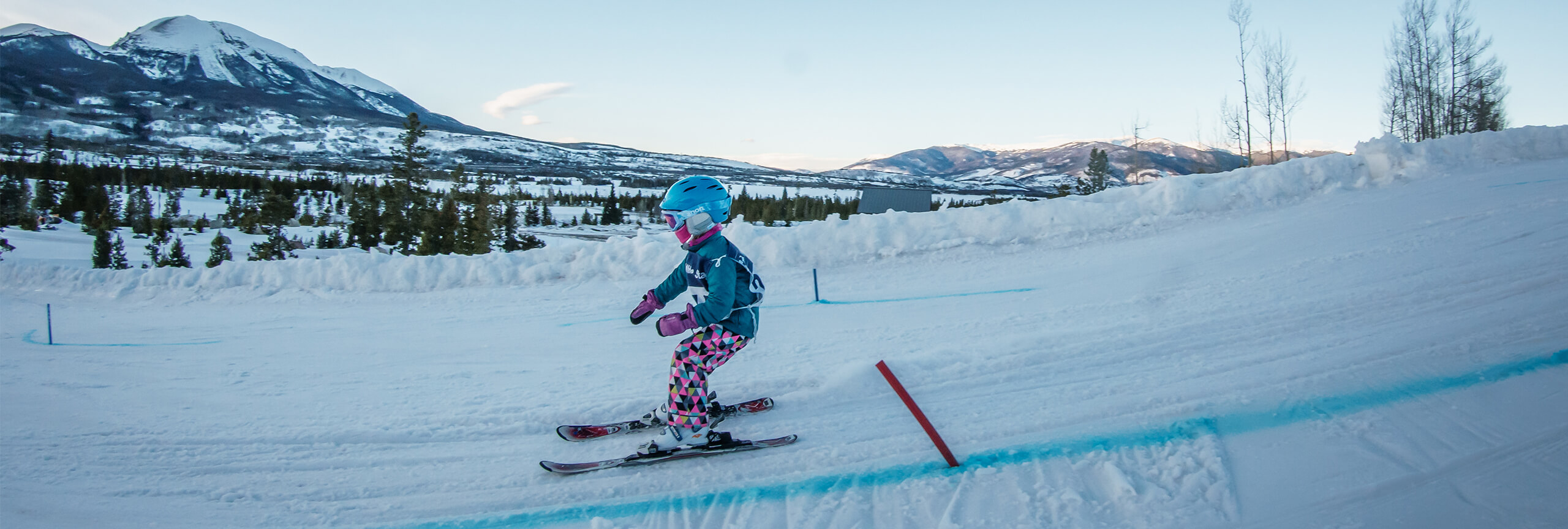 Girl skiing on down beginner ski/ride hill at Frisco Adventure Park